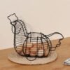 8f334249-9774-436c-a643-bfd3fd317f38.jpg Vintage-Style Round Metal Egg Basket with Handle - Rustic Wire Design for Efficient Egg Collection